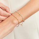 PULSEIRA COM PÉROLAS E ZIRCÔNIA REDONDA EM PÊNDULO